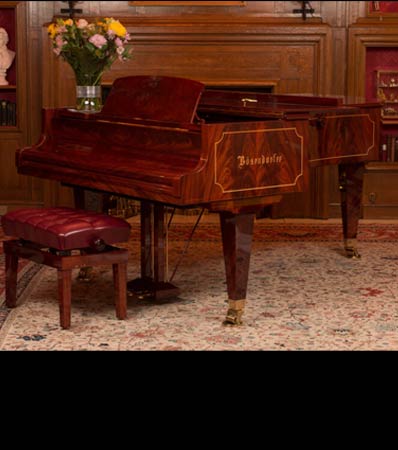A Bösendorfer Model 225 Mahogany and Pearwood Inlay Ninety-Two Key Grand Piano with Conforming Bench 